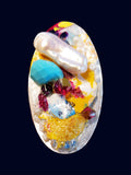 baroque fresh-water pearl, sleeping beauty turquoise, red, burgundy and vibrant yellow on an oval ring of raw mother of pearl